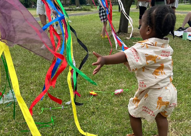 A child playing with ribbons